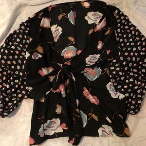 Wrap like top with ruffled sleeves